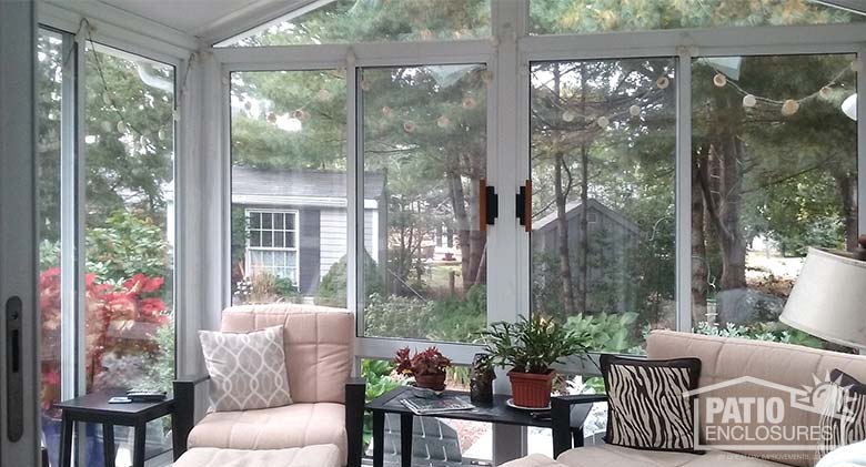 Three season sunroom with insulated glass and gable roof.