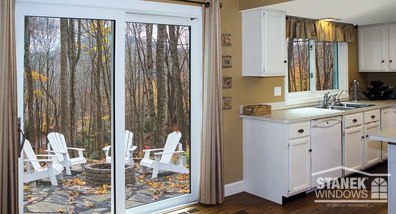 Two-lite patio door in white with two-lite sliding window in the background.
