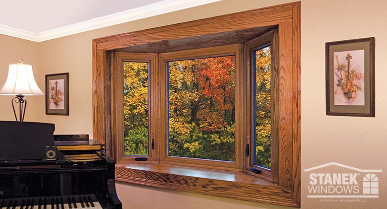 Three-lite bay window with woodgrain interior finish.