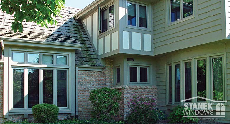Casement windows and five-lite bow window (bottom right) in custom exterior color.