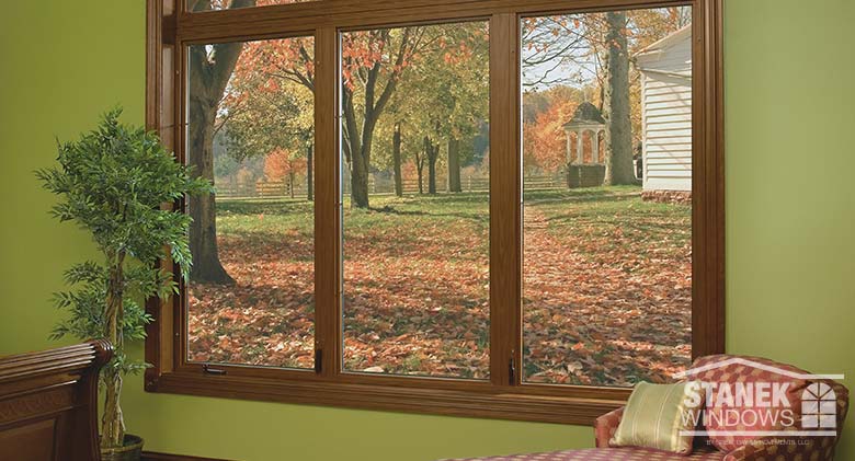 Three-lite casement windows in interior woodgrain finish.