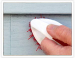 Use a brush to spot clean your siding