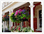 Hang potted plants on your front porch.