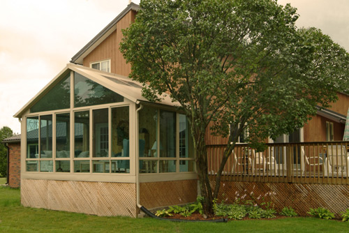 Outside View Of A Sunroom With Vaulted Ceiling As Part Of A Deck