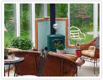 Simple sunroom fireplace in a solarium.