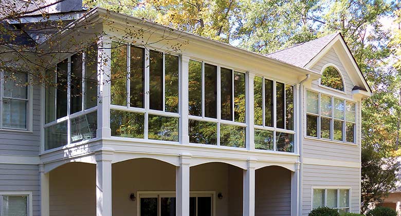 A second-story covered porch was converted into a three-season room.
