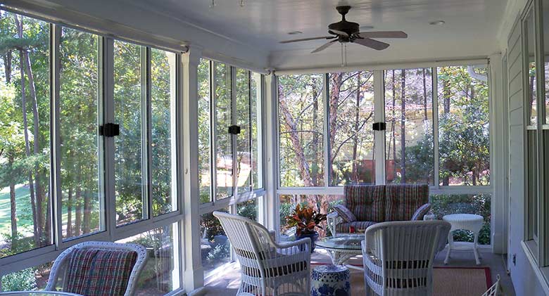 A covered porch was converted into a three-season room for extended seasonal use.