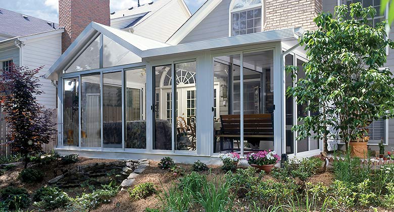 Natural light is abundant in this Elite three-season room with half gable, half single-slope roof.