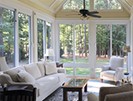 Patio Enclosures summery four season room with white seating